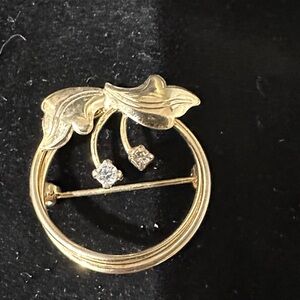 Elegant Gold toned Brooch with Leaf Design